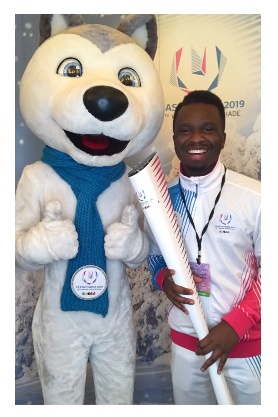 Illustrious Ewhorlu with the Krasnoyarsk 2019 Winter Universiade mascot and torch