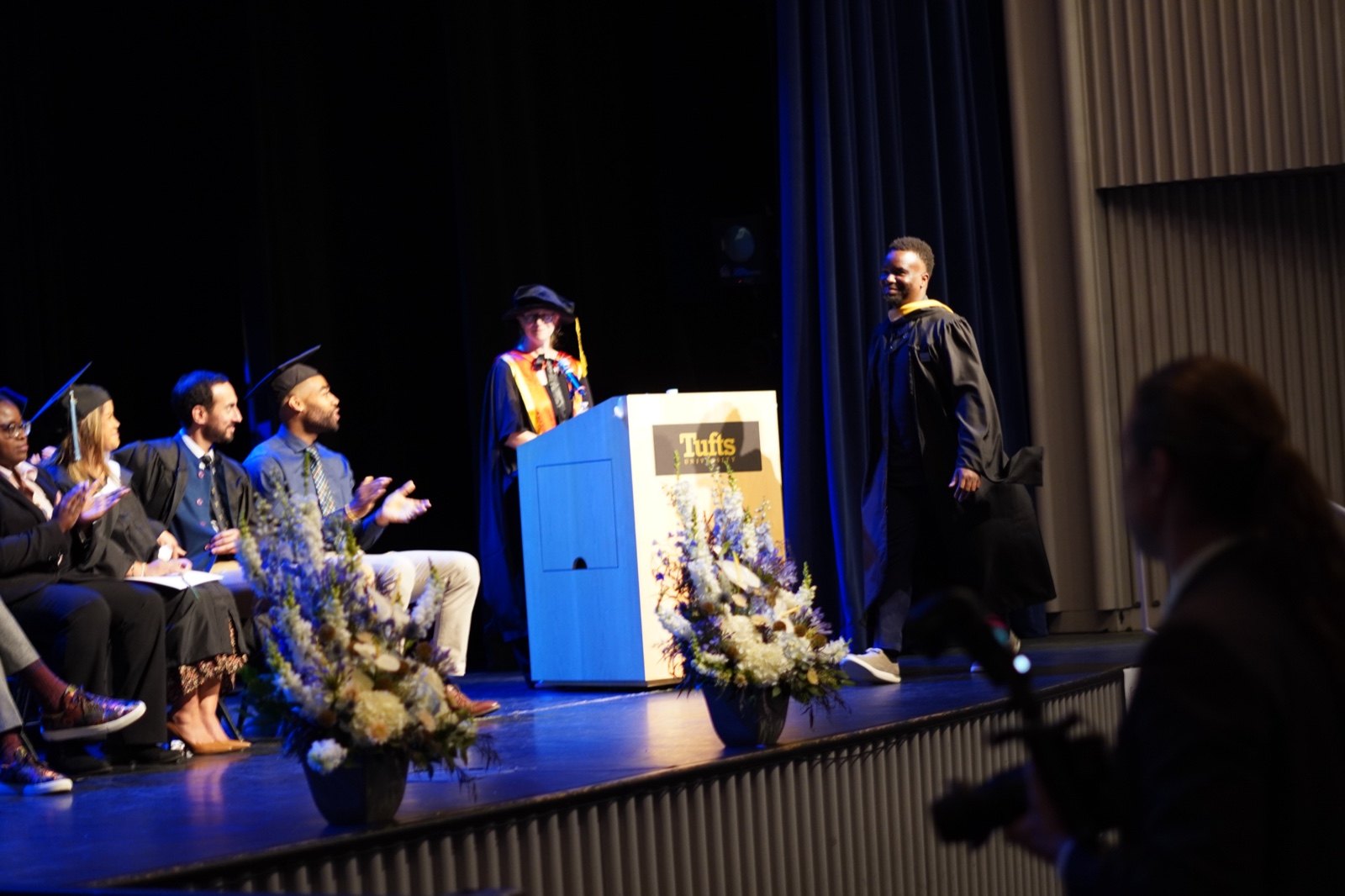 Illustrious Ewhorlu on stage at his Tufts University graduation ceremony